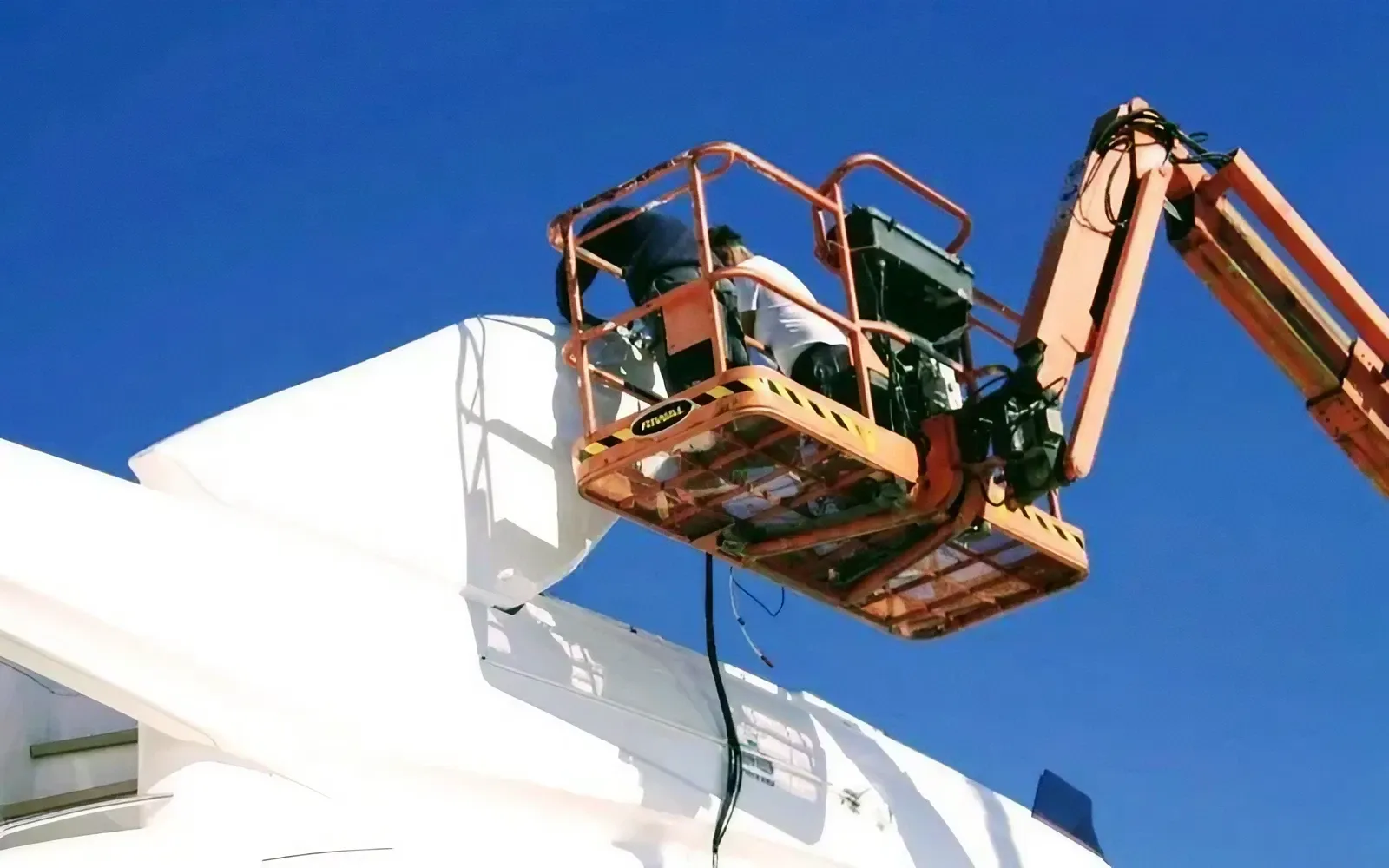 Hull and superstructure painting on a yacht at the Yacht Glow yard.